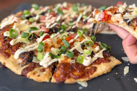 pizza with slice lifted pizza with slice lifted